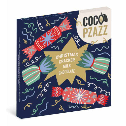 Coco Pazzz Christmas Cracker Milk Chocolate box, featuring a festive navy blue background decorated with colorful illustrations of crackers, candy canes, and a gold starburst in the center.